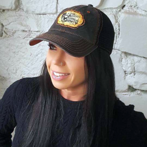 Stacey H. sporting one of our custom baseball caps done for an awesome, woman owned tattoo shop.
