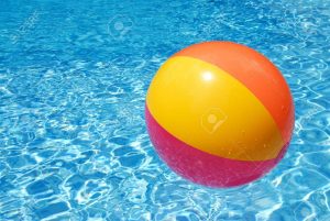 1298520-a-colorful-beach-ball-floating-on-the-swimming-pool